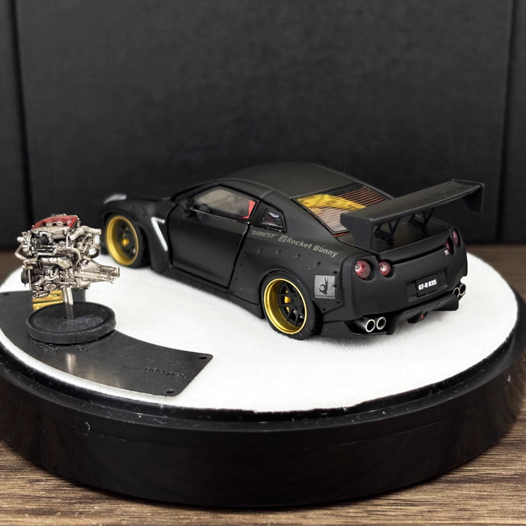 PGM 1:64 Nissan Skyline GT-R R35 Pandem Rocket Bunny Matt Black with Separated Display Engine Limited 999 Pieces (Premium Round Box Packaging)