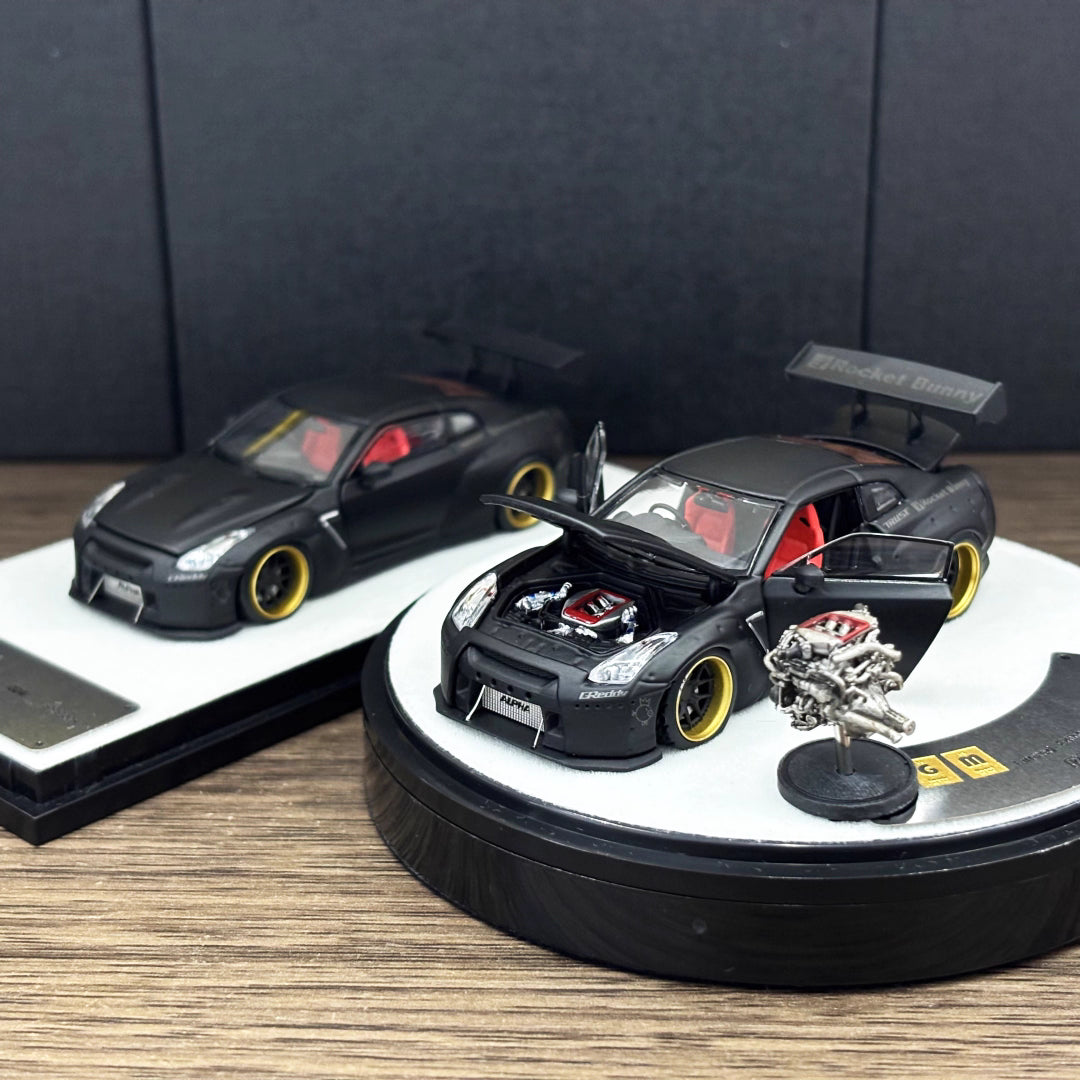 PGM 1:64 Nissan Skyline GT-R R35 Pandem Rocket Bunny Matt Black with Separated Display Engine Limited 999 Pieces (Premium Round Box Packaging)