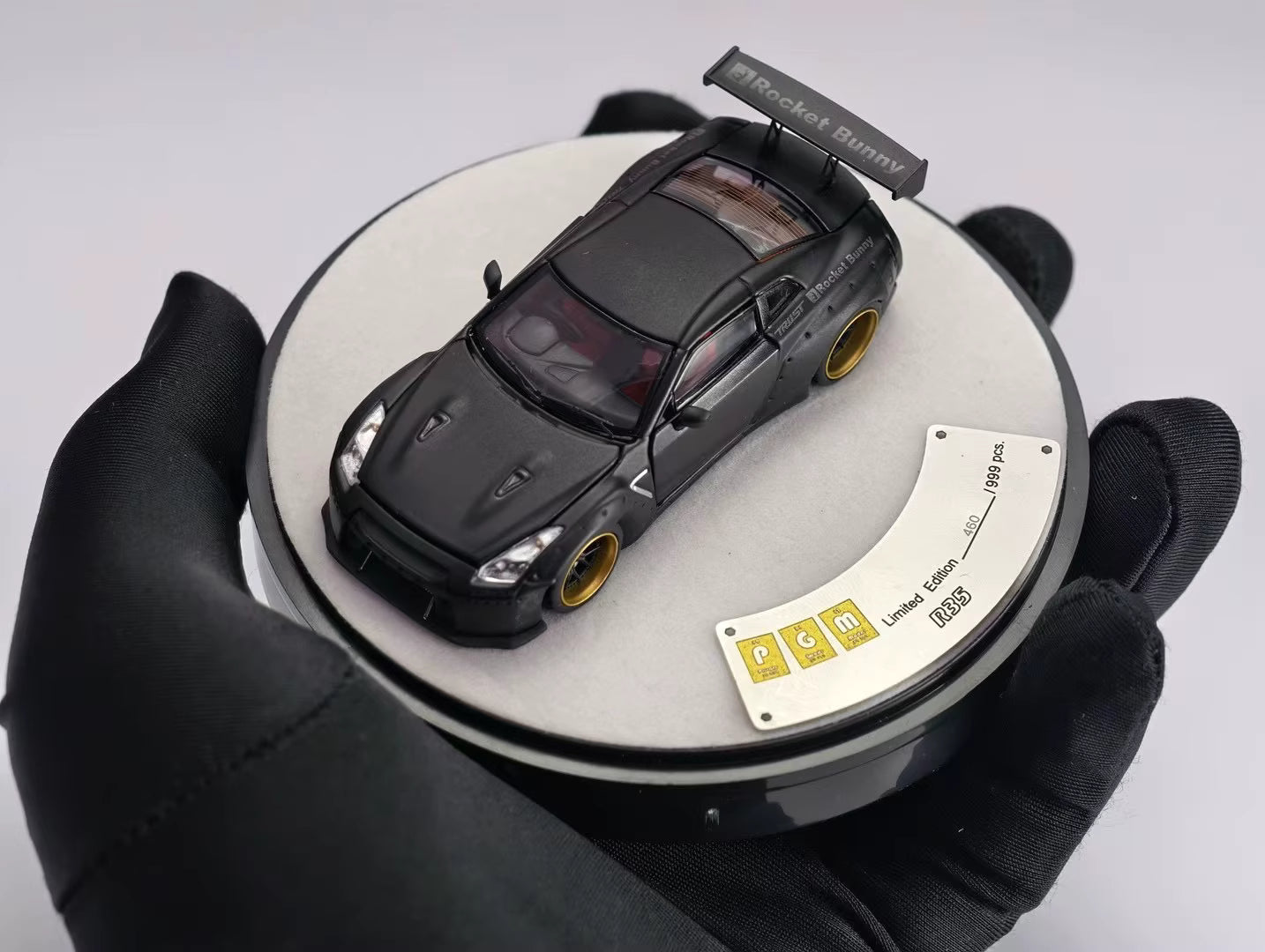 PGM 1:64 Nissan Skyline GT-R R35 Pandem Rocket Bunny Matt Black with Separated Display Engine Limited 999 Pieces (Premium Round Box Packaging)