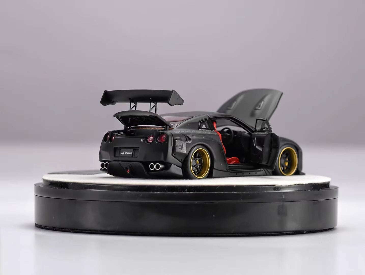 PGM 1:64 Nissan Skyline GT-R R35 Pandem Rocket Bunny Matt Black with Separated Display Engine Limited 999 Pieces (Premium Round Box Packaging)