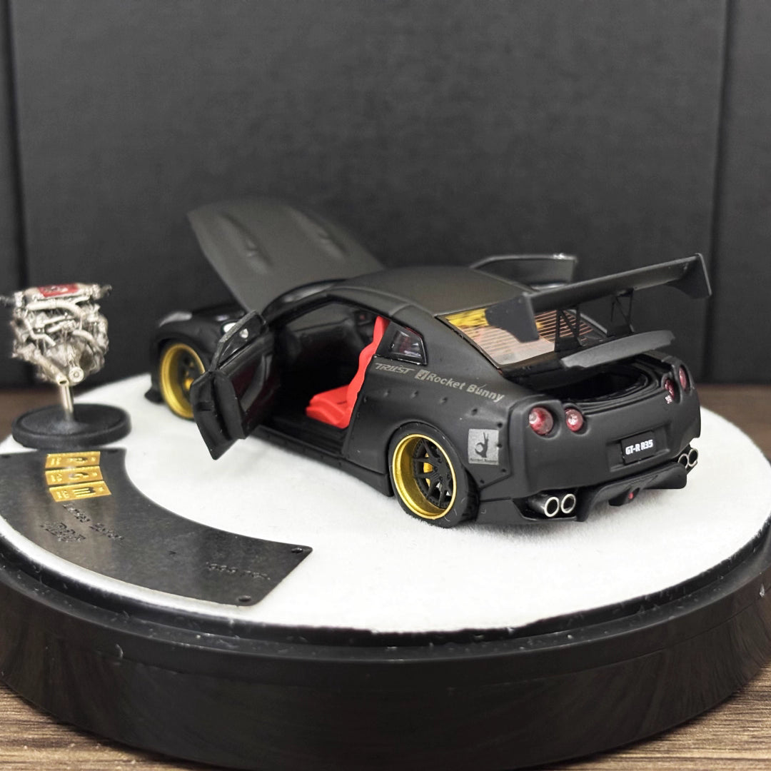 PGM 1:64 Nissan Skyline GT-R R35 Pandem Rocket Bunny Matt Black with Separated Display Engine Limited 999 Pieces (Premium Round Box Packaging)
