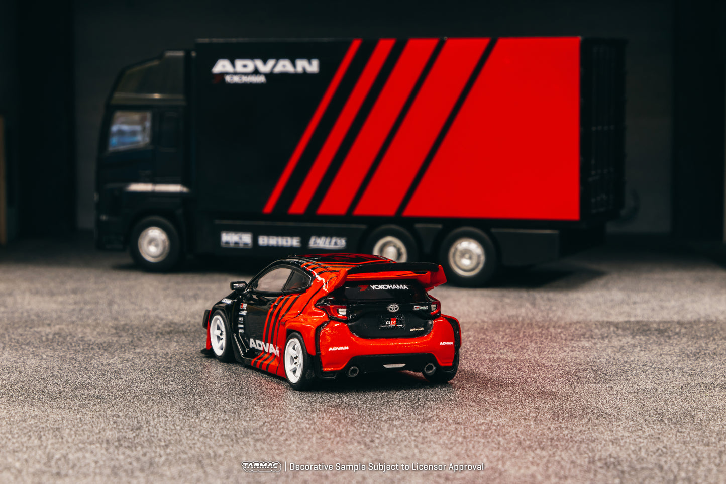 Tarmac Works 1/64 Toyota Pandem Yaris ADVAN with Plastic Truck Packaging - HOBBY64
