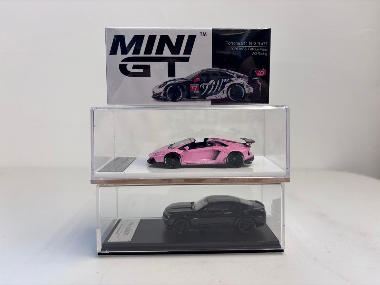 [3 Cars Bundle] Mini GT 1:64 Porsche 911 GT3 R #77 AO Racing 2025 IMSA Petit Le Mans in Paper Box Packaging (MGT01143-CH)  + [Premium Resin Model] Fine Works 1:64 Aventador LP700-4 Pink Luminous + Fine Works 1:64 Camaro Transformers Full Black