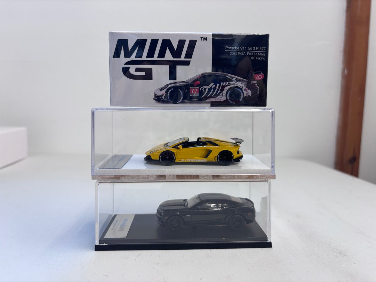 [3 Cars Bundle] Mini GT 1:64 Porsche 911 GT3 R #77 AO Racing 2025 IMSA Petit Le Mans in Paper Box Packaging (MGT01143-CH)  + [Premium Resin Model] Fine Works 1:64 Aventador LP700-4 Yellow + Fine Works 1:64 Camaro Transformers Full Black