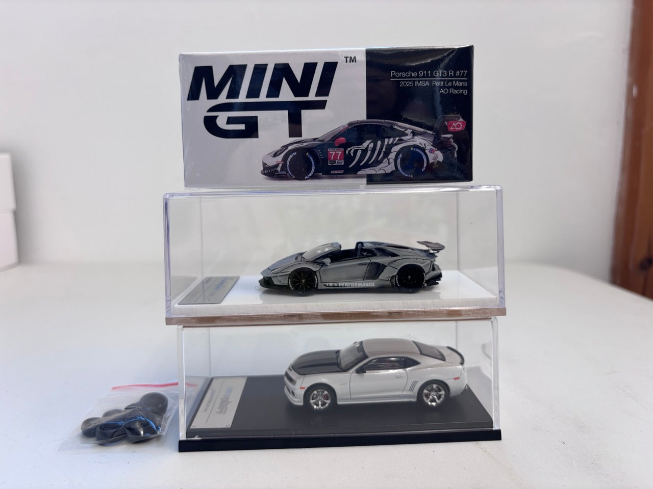 [3 Cars Bundle] Mini GT 1:64 Porsche 911 GT3 R #77 AO Racing 2025 IMSA Petit Le Mans in Paper Box Packaging (MGT01143-CH)  + [Premium Resin Model] Fine Works 1:64 Aventador LP700-4 Combat White + Fine Works 1:64 Camaro Transformers White
