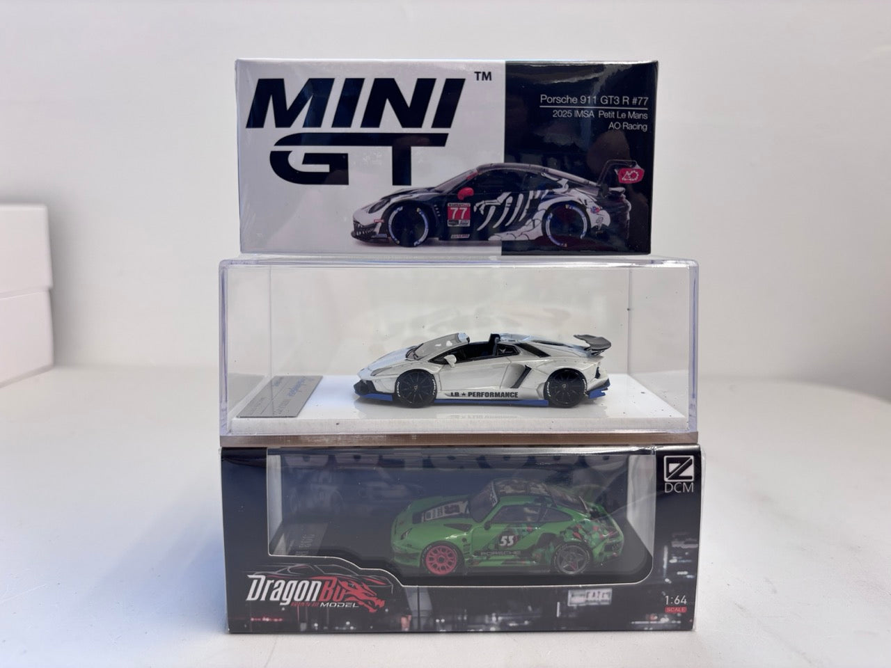 [3 Cars Bundle] Mini GT 1:64 Porsche 911 GT3 R #77 AO Racing 2025 IMSA Petit Le Mans in Paper Box Packaging (MGT01143-CH)  + [Premium Resin Model] Fine Works 1:64 Aventador LP700-4 White + DCM 1:64 RWB 993 Duck Tail Green