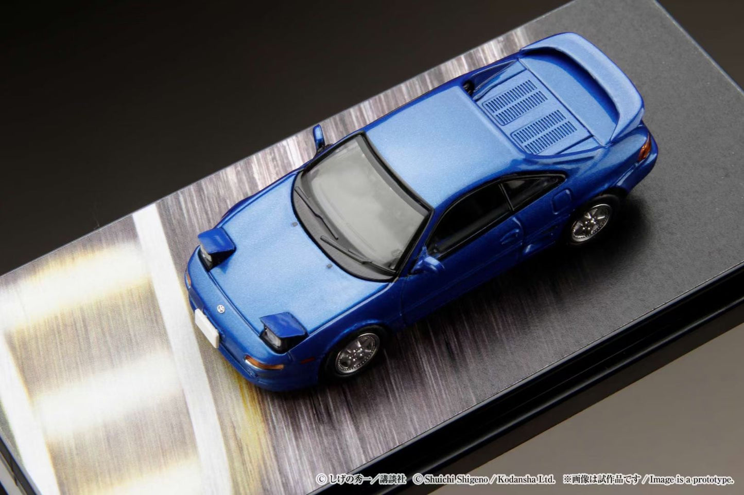 Hobby Japan 1:64 Toyota MR2 SW20 G-Limited Folding Headlight Initial D Official Licensed Kai Kogashiwa VS Takumi Fujiwara with Kai Kogashiwa Figure Driving In The Car