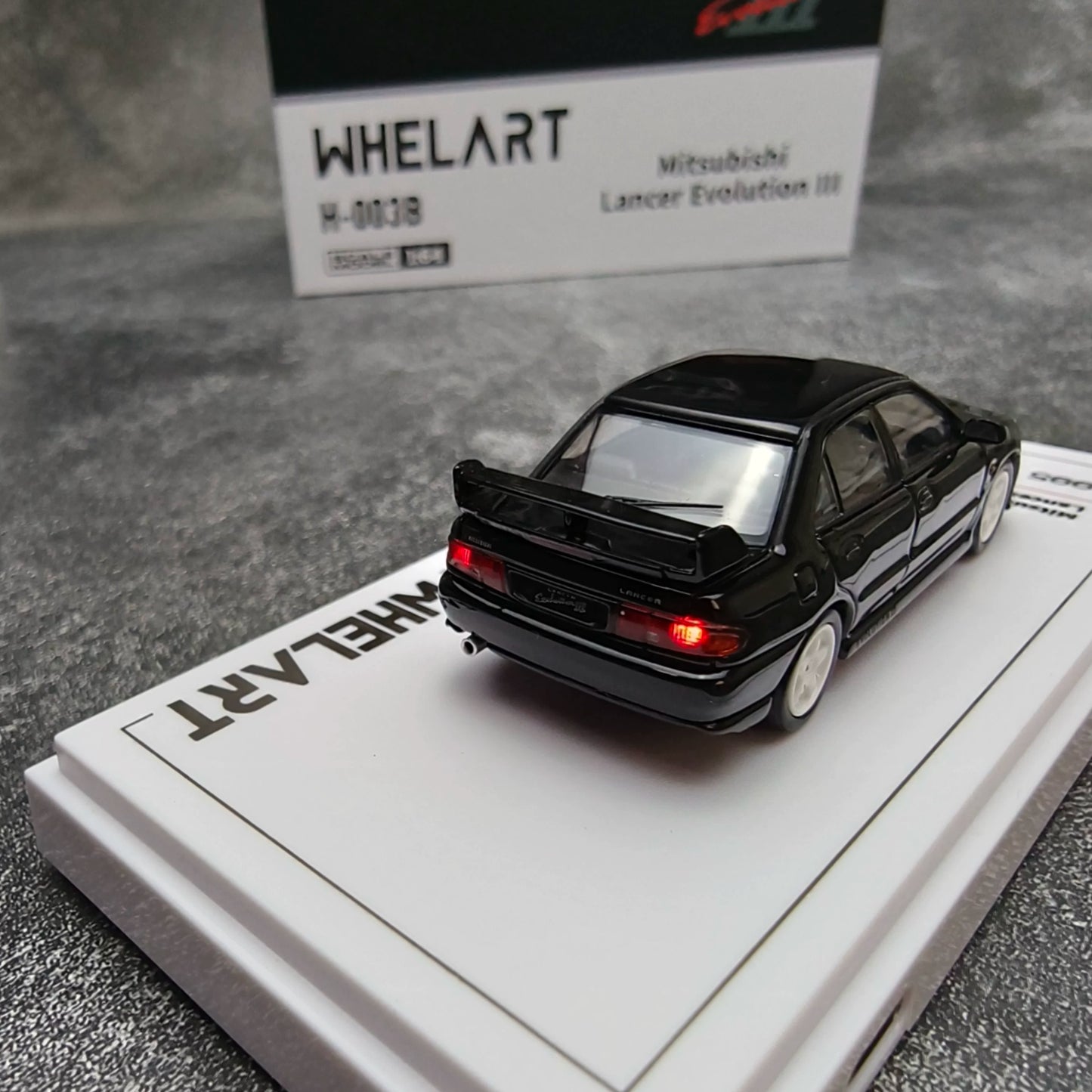 Whelart 1:64 Mitsubishi Lancer Evolution III Black LED Head and Back Lights with Car Key Shape Controller in Premium Box Packaging (Official Licensed)