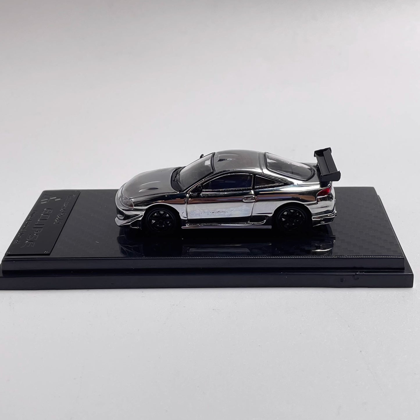 Transcend Model 1:64 Mitsubishi Eclipse Chrome Gun Grey