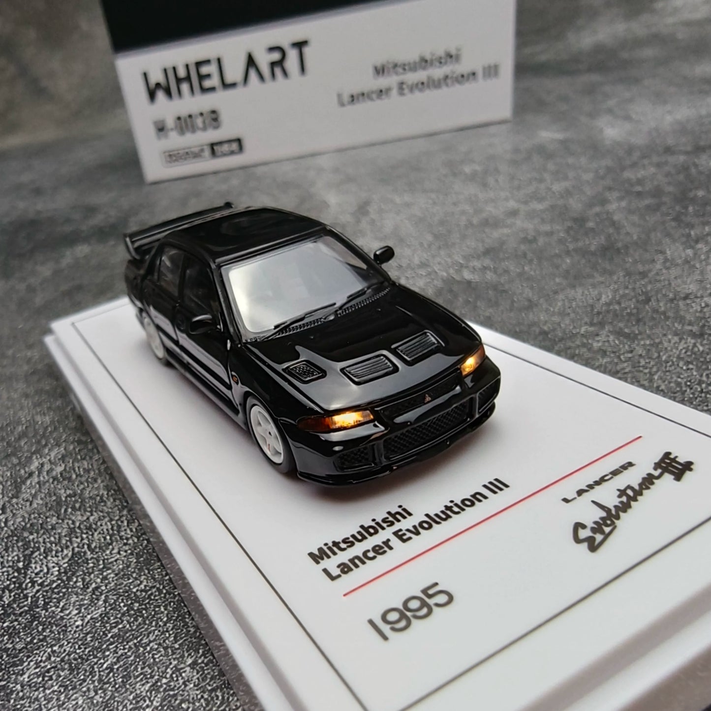 Whelart 1:64 Mitsubishi Lancer Evolution III Black LED Head and Back Lights with Car Key Shape Controller in Premium Box Packaging (Official Licensed)